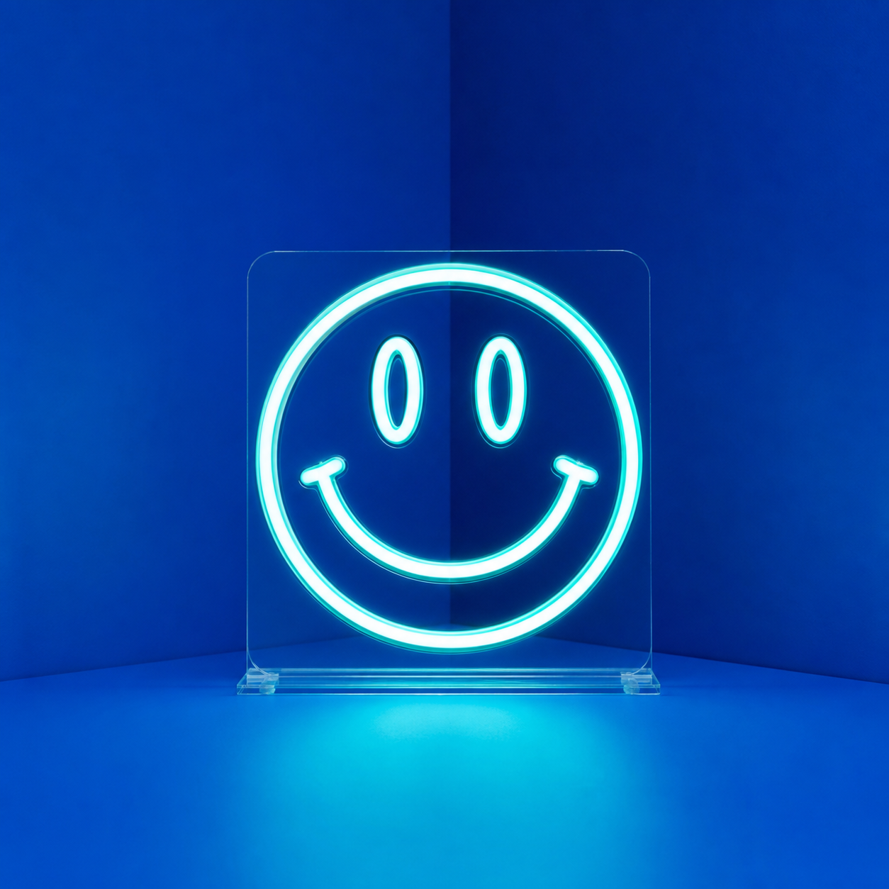 Aqua LED neon smile in a blue studio