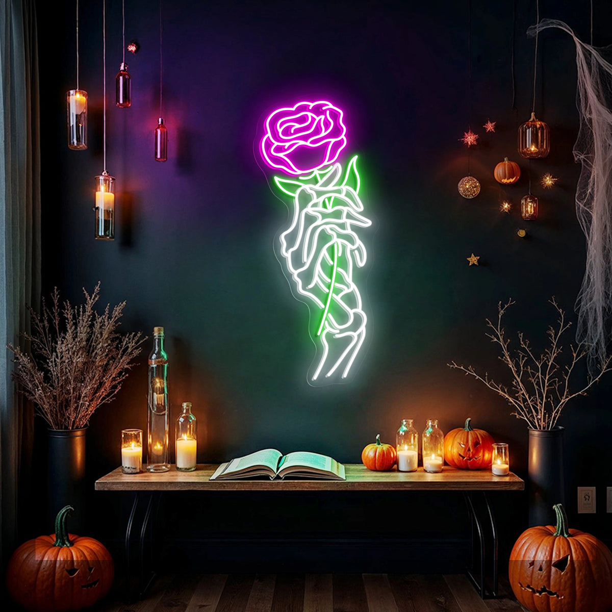 Skeleton hand holding a red rose neon sign glowing on a dark wall above gothic shelf decor